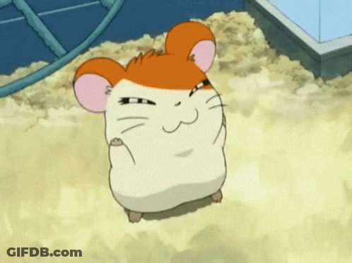 A Cartoon Hamster Is Sitting In A Pile Of Sand . GIF