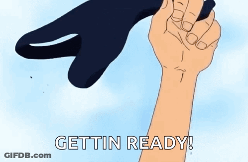 A Cartoon Hand Is Holding A Black Object With The Words Gettin Ready Written On It . GIF