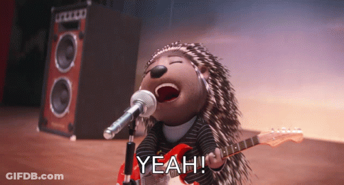 A Cartoon Hedgehog Singing Into A Microphone While Holding A Guitar And The Word Yeah Next To Him GIF