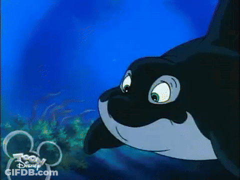 A Cartoon Killer Whale From Toon Disney Is Swimming In The Ocean GIF