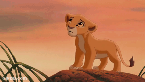 A Cartoon Lion Cub Is Standing On A Rock GIF