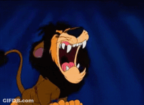 A Cartoon Lion With Its Mouth Open And Sharp Teeth GIF