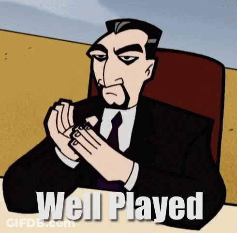 A Cartoon Man In A Suit And Tie Is Sitting At A Table With The Words Well Played Written Below Him GIF