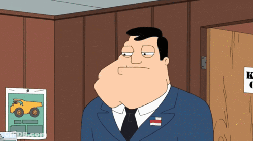 Cartoon Man In Suit And Tie Standing In Front Of Door GIF