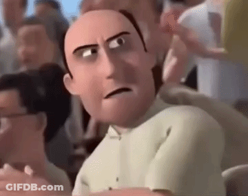 A Cartoon Man With A Bald Head Is Sitting In A Crowd Of People . GIF
