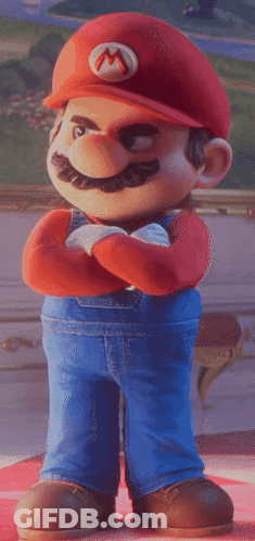 A Cartoon Mario With His Arms Crossed And A M On His Hat GIF