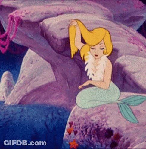 A Cartoon Mermaid Is Sitting On A Rock In The Ocean GIF