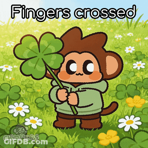 A Cartoon Monkey Holding A Four Leaf Clover With The Words Fingers Crossed Above Him GIF