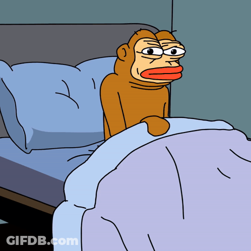A Cartoon Monkey Is Sitting On A Bed With A Blue Blanket GIF