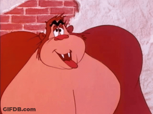 A Cartoon Monkey Is Sticking Its Tongue Out GIF