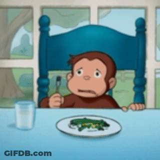 A Cartoon Monkey Sitting At A Table With A Plate Of Food And A Glass Of Milk GIF