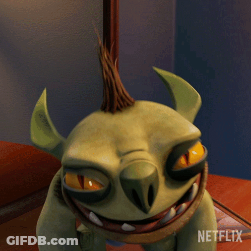 A Cartoon Monster Is Sitting On A Table Next To A Netflix Sign GIF
