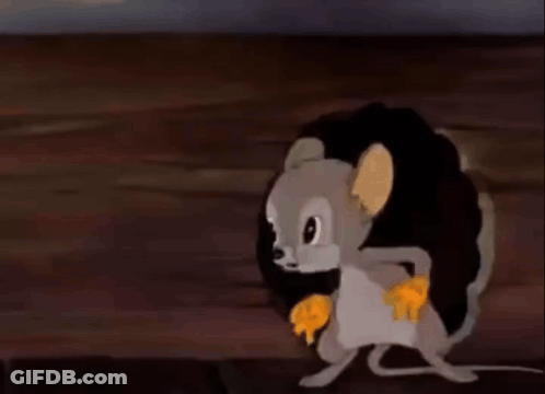 A Cartoon Mouse Is Running Through A Hole In A Wall And Eating A Piece Of Cheese . GIF