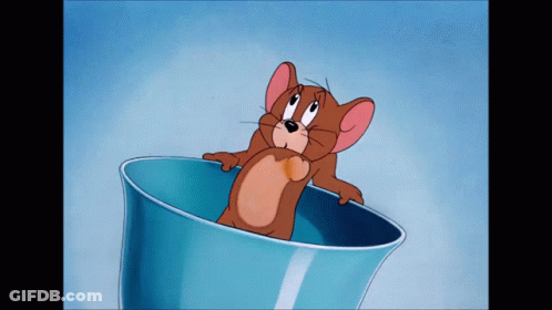 A Cartoon Mouse Is Sitting In A Blue Bowl GIF