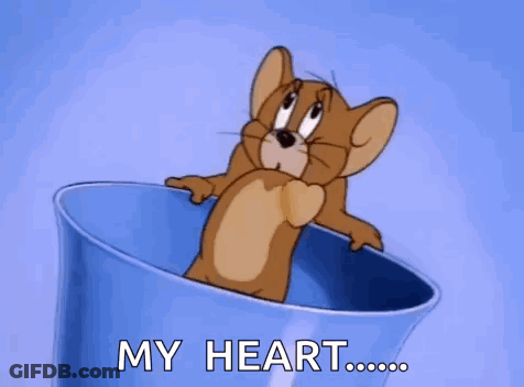 A Cartoon Mouse Is Sitting In A Blue Cup With The Words `` My Heart '' Written On It . GIF