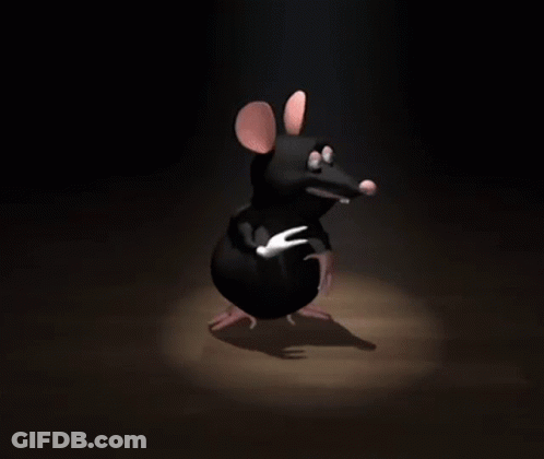 A Cartoon Mouse Is Standing In The Dark And Pointing GIF