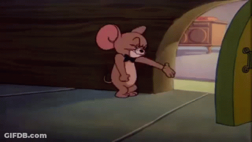 A Cartoon Mouse Wearing A Bow Tie Is Standing In Front Of A Door . GIF