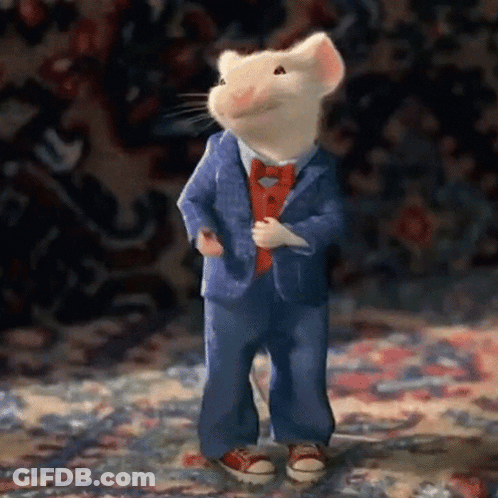 A Cartoon Mouse Wearing A Suit And Tie GIF