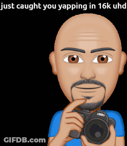 A Cartoon Of A Bald Man Holding A Camera With The Words Just Caught You Yapping In 16K Uhd Above Him GIF