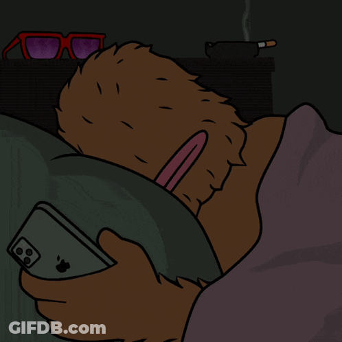 A Cartoon Of A Bear Laying In Bed Holding An Apple Iphone GIF