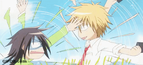 A Cartoon Of A Boy And A Girl Fighting With Their Hands In The Air . GIF