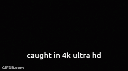 A Cartoon Of A Boy Holding A Cell Phone With The Words " Caught In 4K Ultra Hd " Above Him GIF