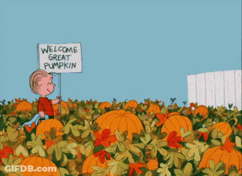 A Cartoon Of A Boy Holding A Sign That Says " Welcome Great Pumpkin " GIF
