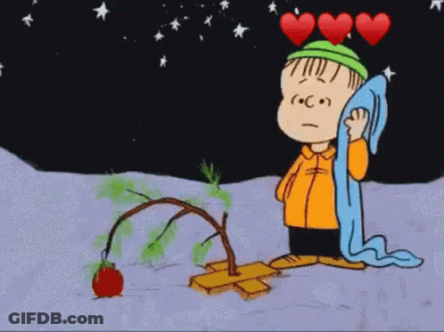 A Cartoon Of A Boy Standing Next To A Christmas Tree With Three Hearts Above Him . GIF