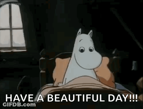 A Cartoon Of A Cat Laying In A Bed With The Words `` Have A Beautiful Day ! '' GIF