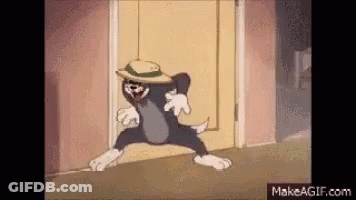 A Cartoon Of A Cat Wearing A Hat Is Walking Through A Doorway . GIF