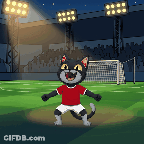 A Cartoon Of A Cat Wearing A Red Shirt And White Shorts On A Soccer Field GIF