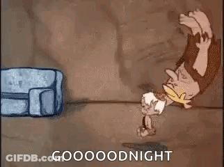 A Cartoon Of A Caveman Standing On His Head Next To A Bag And A Couch . GIF