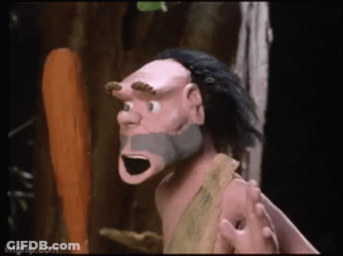 A Cartoon Of A Caveman With A Beard And Horns GIF