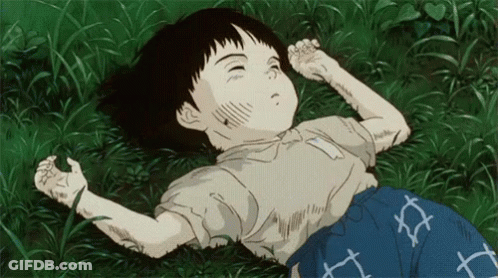 A Cartoon Of A Child Laying In The Grass GIF
