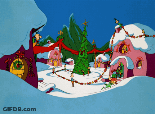 A Cartoon Of A Christmas Village With A Christmas Tree GIF