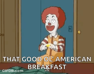 A Cartoon Of A Clown Holding A Mcdonald 'S Sign And Saying `` That Good Ol ' American Breakfast `` . GIF