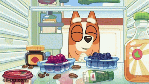 A Cartoon Of A Dog In A Fridge With A Bottle Of Orange Juice GIF