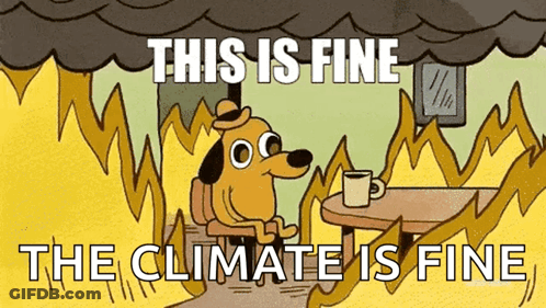 A Cartoon Of A Dog Sitting At A Table With A Cup Of Coffee In Front Of A Fire . GIF