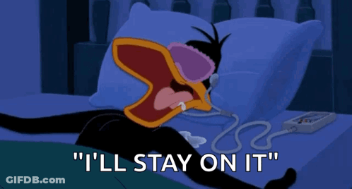 A Cartoon Of A Duck Laying On A Bed With The Words " I 'Ll Stay On It " Below Him GIF