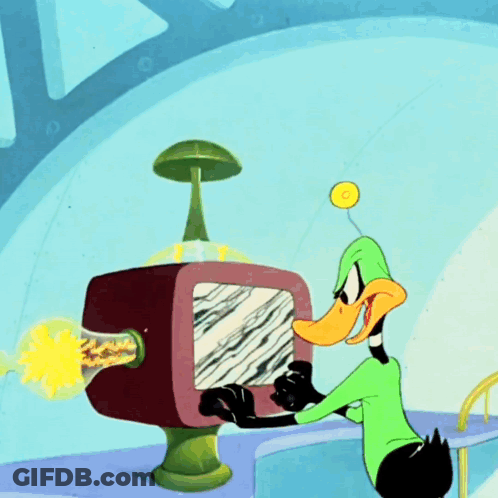 A Cartoon Of A Duck Looking At A Computer Screen GIF