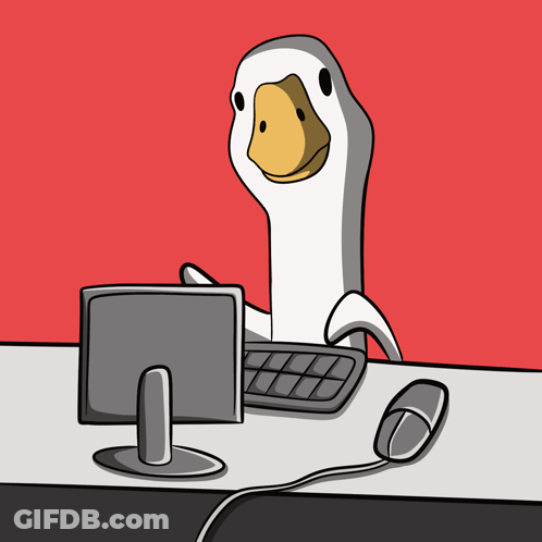 A Cartoon Of A Duck Sitting At A Desk With A Keyboard And Mouse GIF