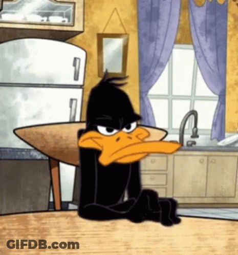 A Cartoon Of A Duck Sitting At A Table With His Arms Crossed GIF