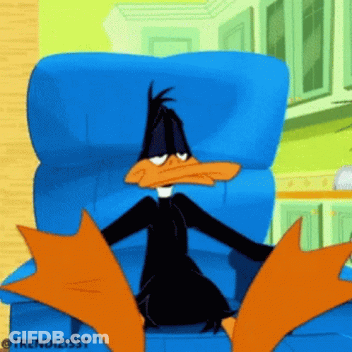 A Cartoon Of A Duck Sitting In A Chair GIF