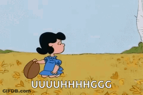A Cartoon Of A Girl Holding A Football In A Field With The Words `` Uuuuuuuhhhgg '' Written On It . GIF