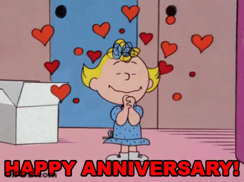 A Cartoon Of A Girl Surrounded By Hearts With The Words Happy Anniversary Written Below Her GIF
