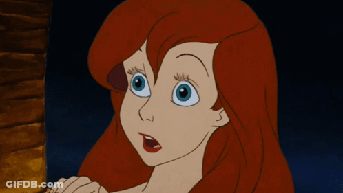 A Cartoon Of A Girl With Red Hair And Blue Eyes GIF