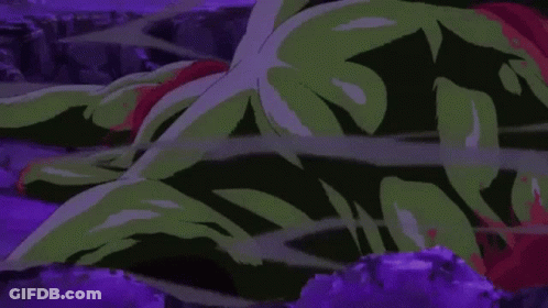 A Cartoon Of A Green Monster Laying On The Ground . GIF