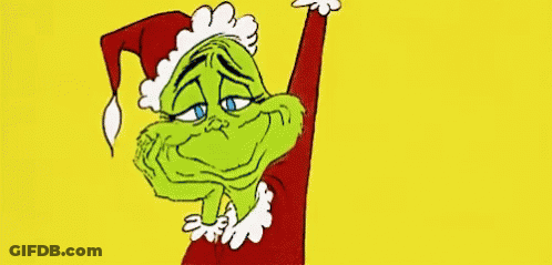 A Cartoon Of A Grinch Wearing A Santa Hat And A Red Jacket . GIF