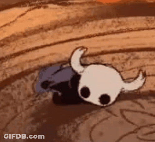 A Cartoon Of A Knight 'S Skull With Horns Is Laying On The Ground . GIF