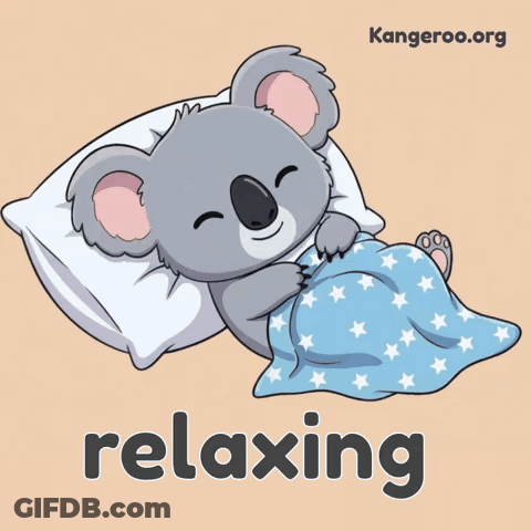 A Cartoon Of A Koala Bear Laying On A Pillow With The Word Relaxing Underneath It GIF
